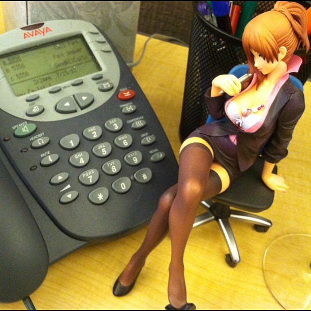 a plastic figurine sitting on top of a desk