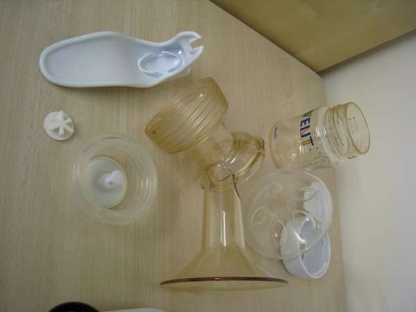 multiple glass objects on a table near a wall