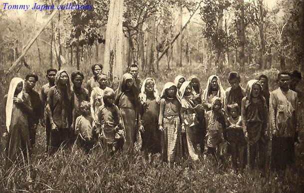 native indian women in traditional costume standing in the woods
