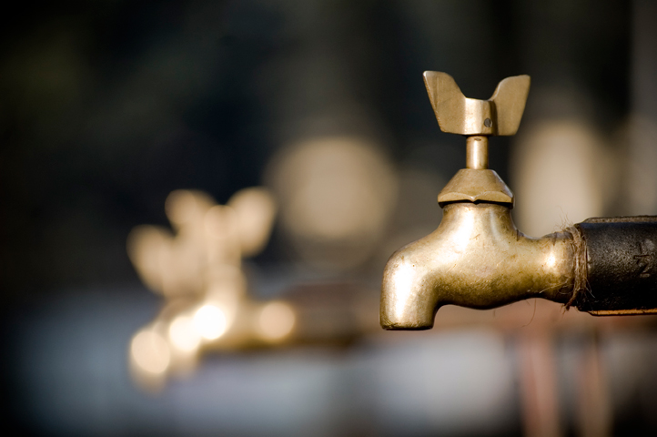 a close up of a faucet with multiple ss colored handles