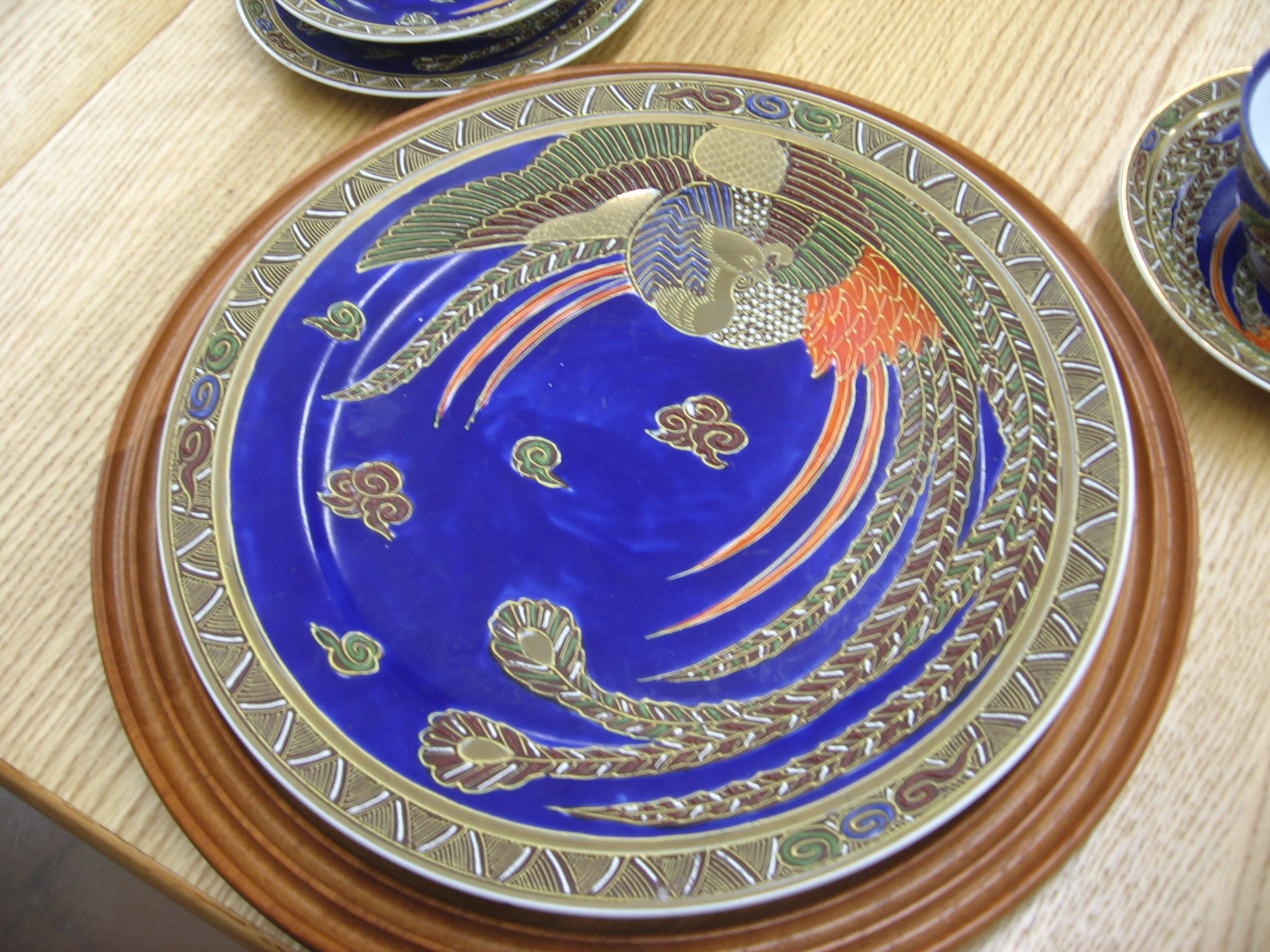 a close up of a plate on a table with plates