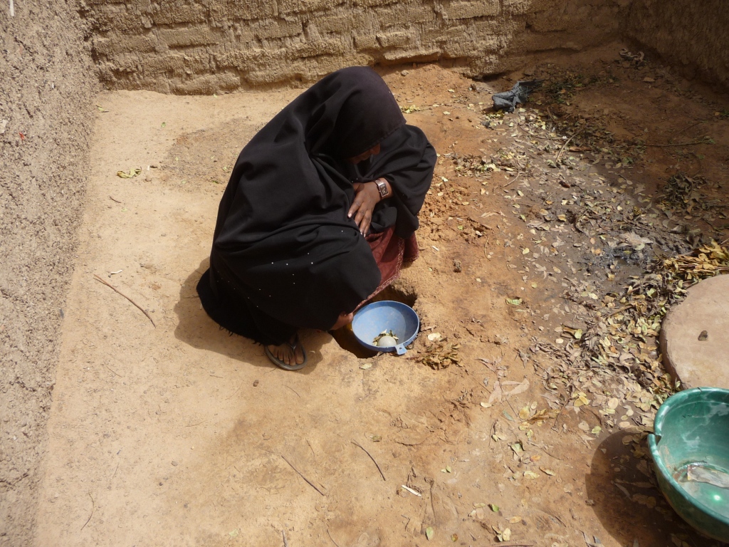 a man kneeling down on the ground