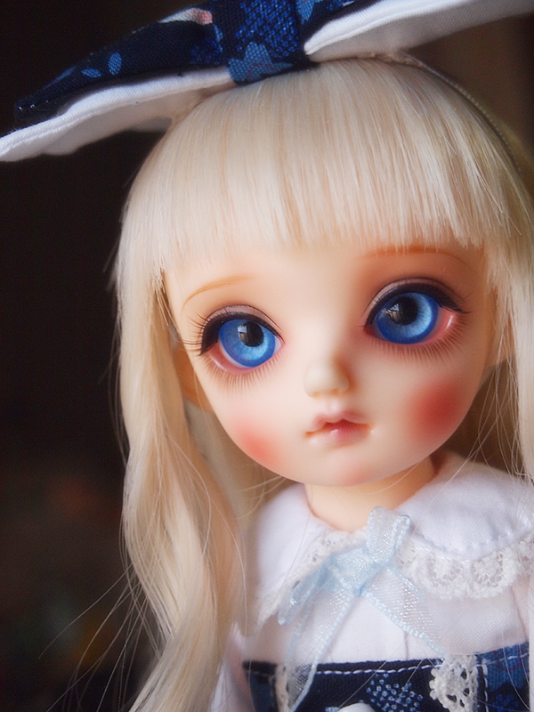 this doll has a big blonde wig with blue eyes