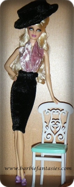barbie doll standing next to a white chair