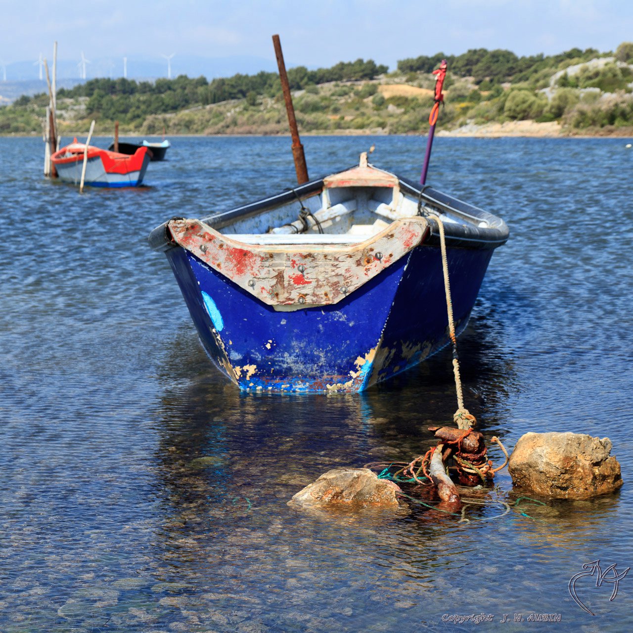 small boats on the shore in the water