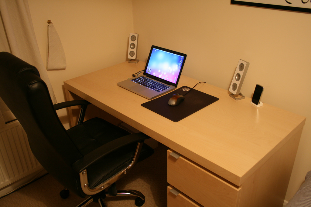 a computer is on a desk with a mouse