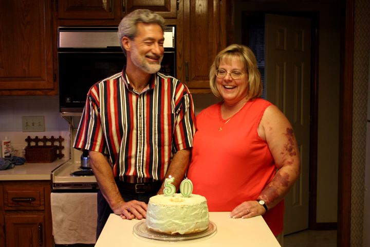 the man and woman are about to cut their cake