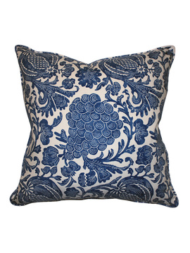 an intricately printed blue and white pillow