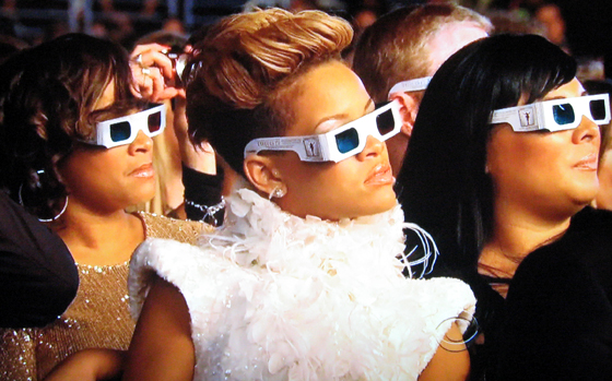two women in white 3d glasses watching movies