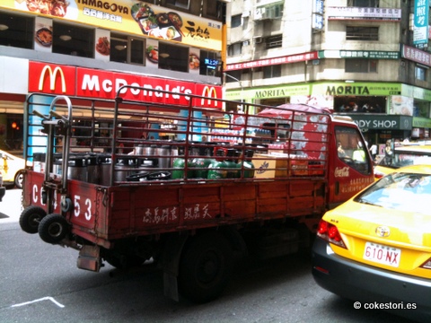 the truck is carrying many items in the back