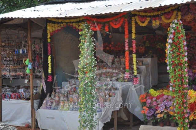 a covered tent with flower strings on it