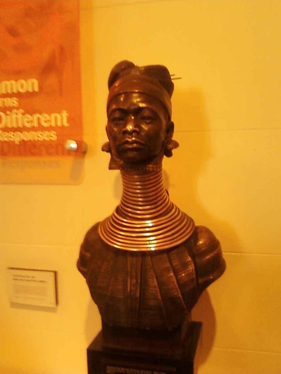 a bronze statue of an african american woman in a museum
