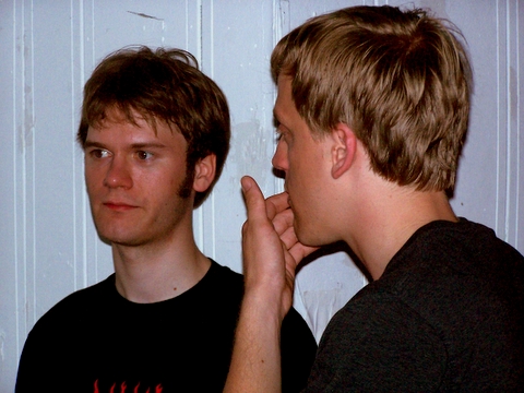 two young men standing next to each other