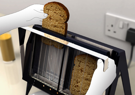 a person pulling toast into a black plastic device