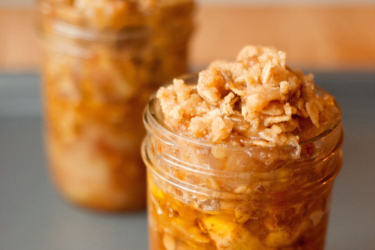 two jars with some oatmeal and other toppings