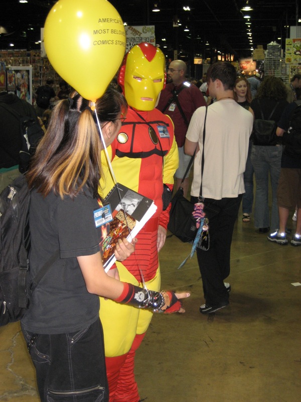 a man in a costume holding a large balloon