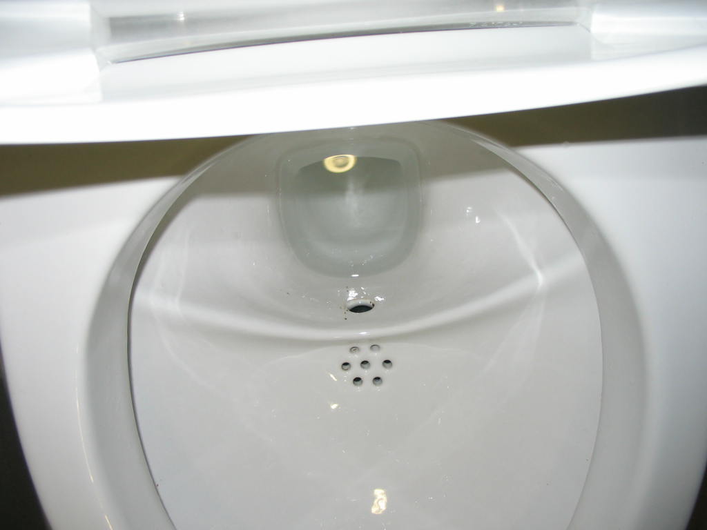 a bathroom sink with a yellow  and soap dispenser