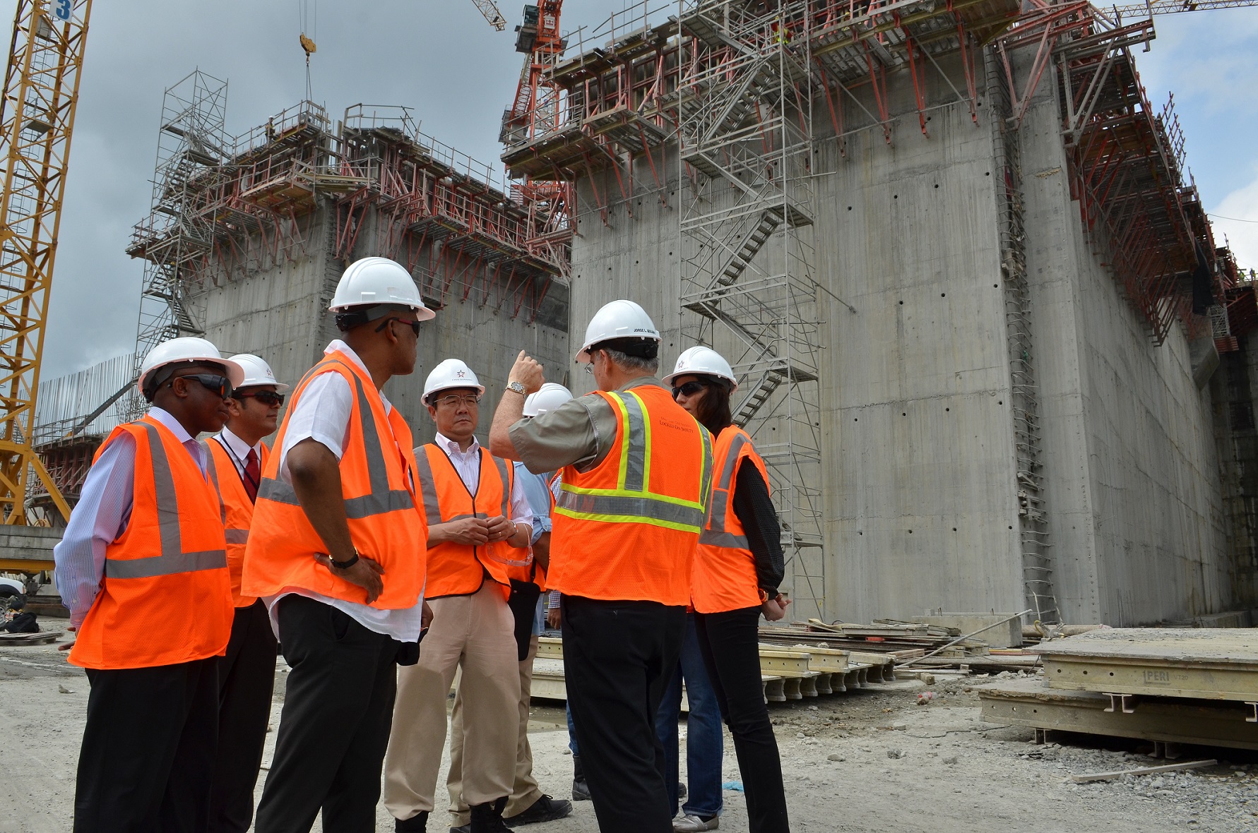 several workers talking on a construction site