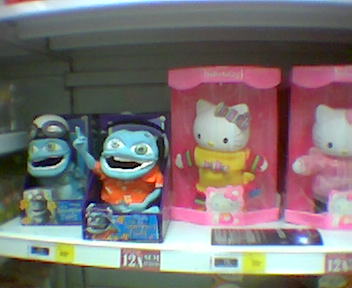 a number of hello kitty toys on a shelf