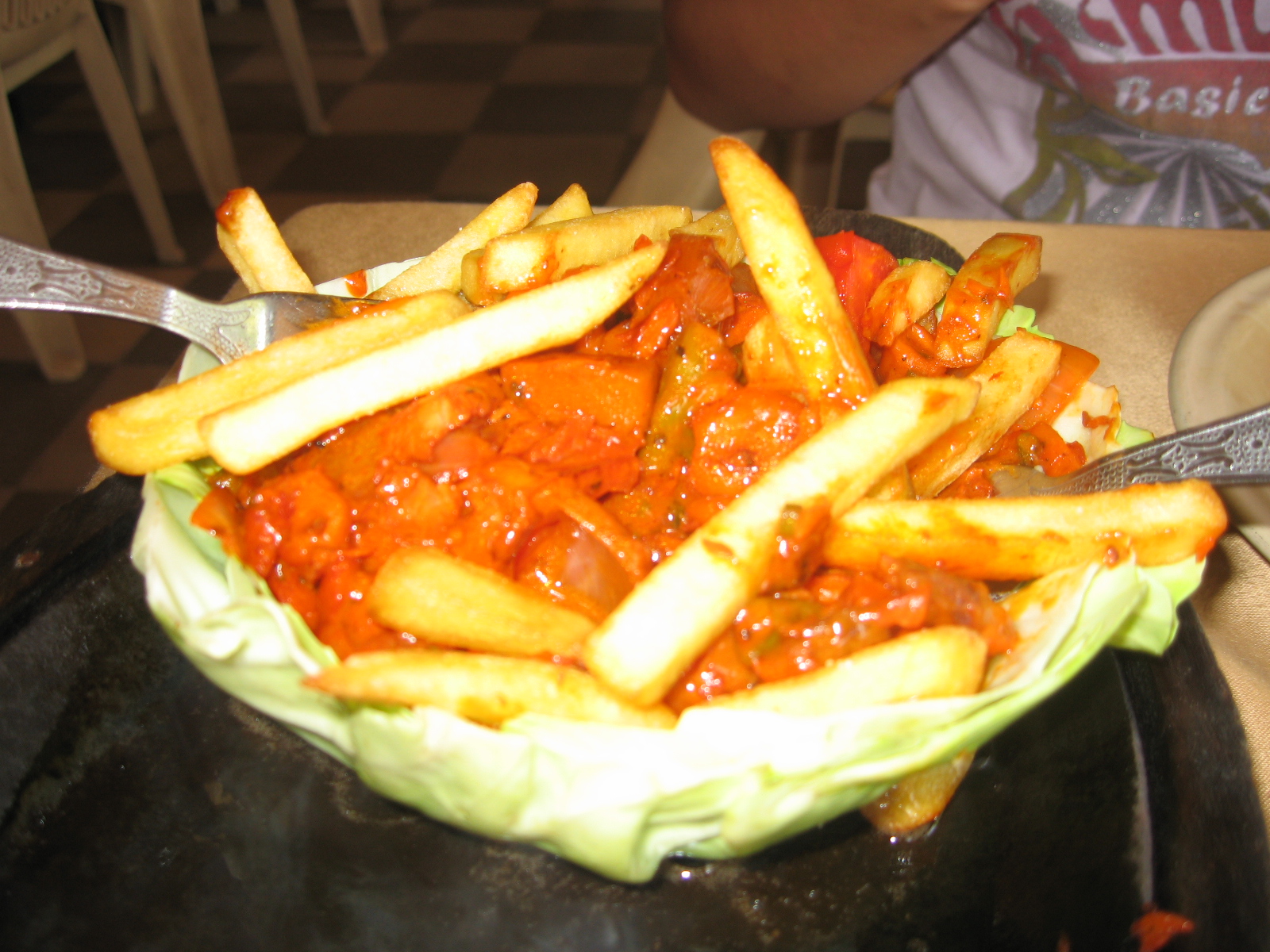 an image of french fries in tomato sauce