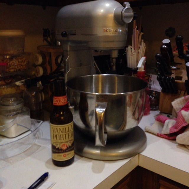 there is a mixer and beer on the kitchen counter