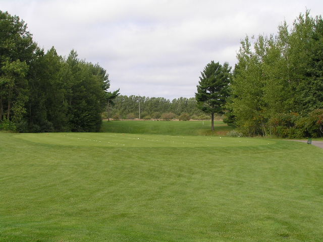 an empty golf course, overlooking the approach from the 1st hole