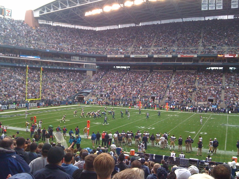 a football game is being played inside a stadium