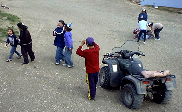 several people are taking pictures of some s near an atv