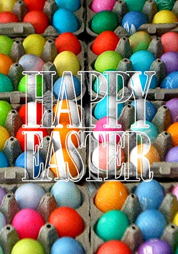 several boxes of colored eggs are stacked with the word happy easter above them