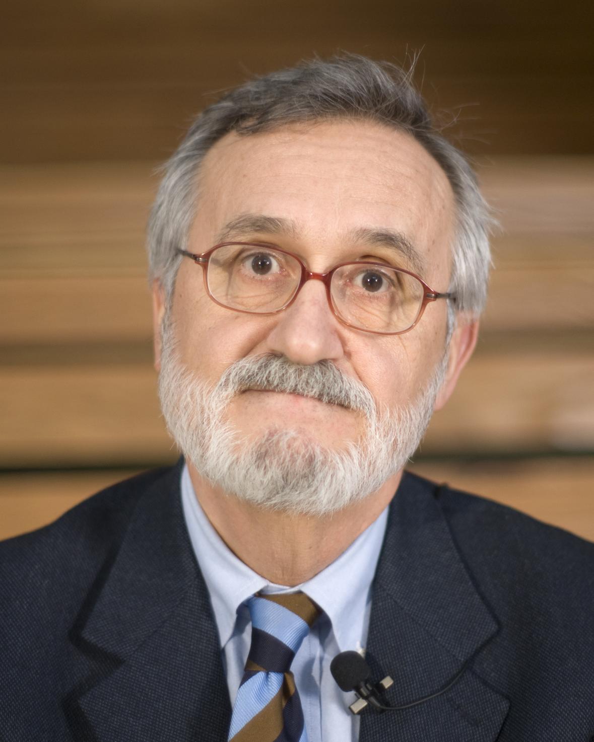 a man with glasses and a white beard