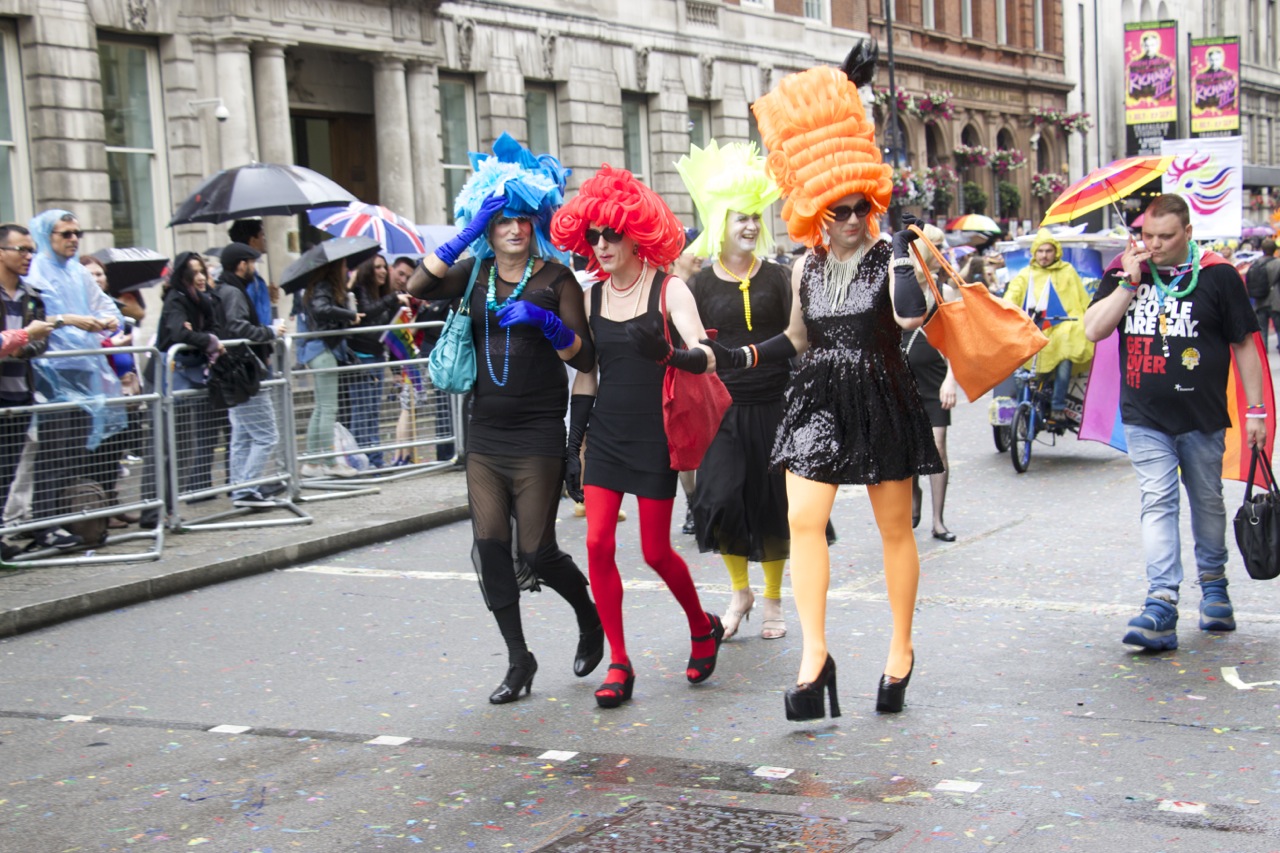 three women in costume walking in a parade