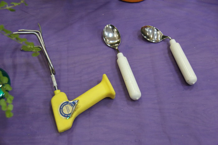 three tools are laid out on a table