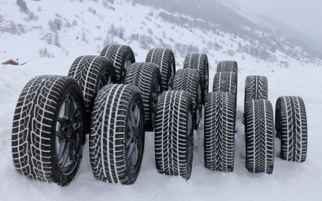 winter tires piled up in the snow