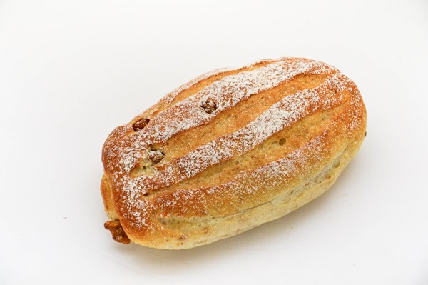 bread on a white surface, with a lot of powdered sugar