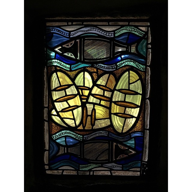 a stained glass window in the center of a building