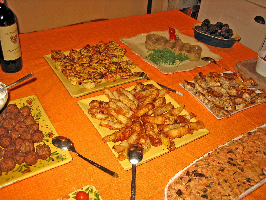 a table that has plates of food on it