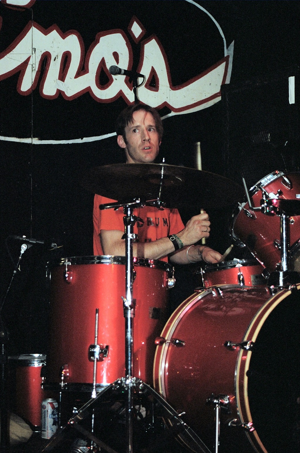 a man is sitting in front of his drums