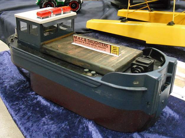 this is an image of a small boat with a radio controlled device on top