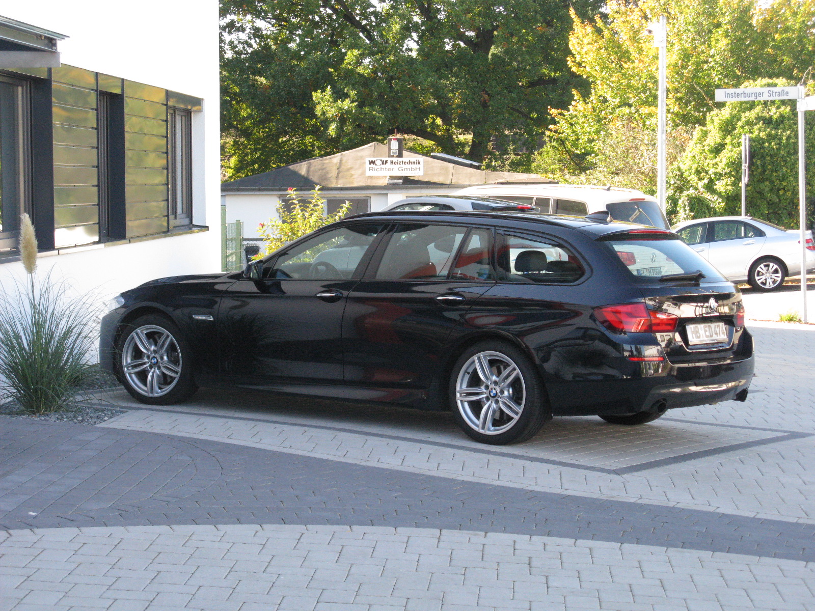 a black car with a police car attached to it