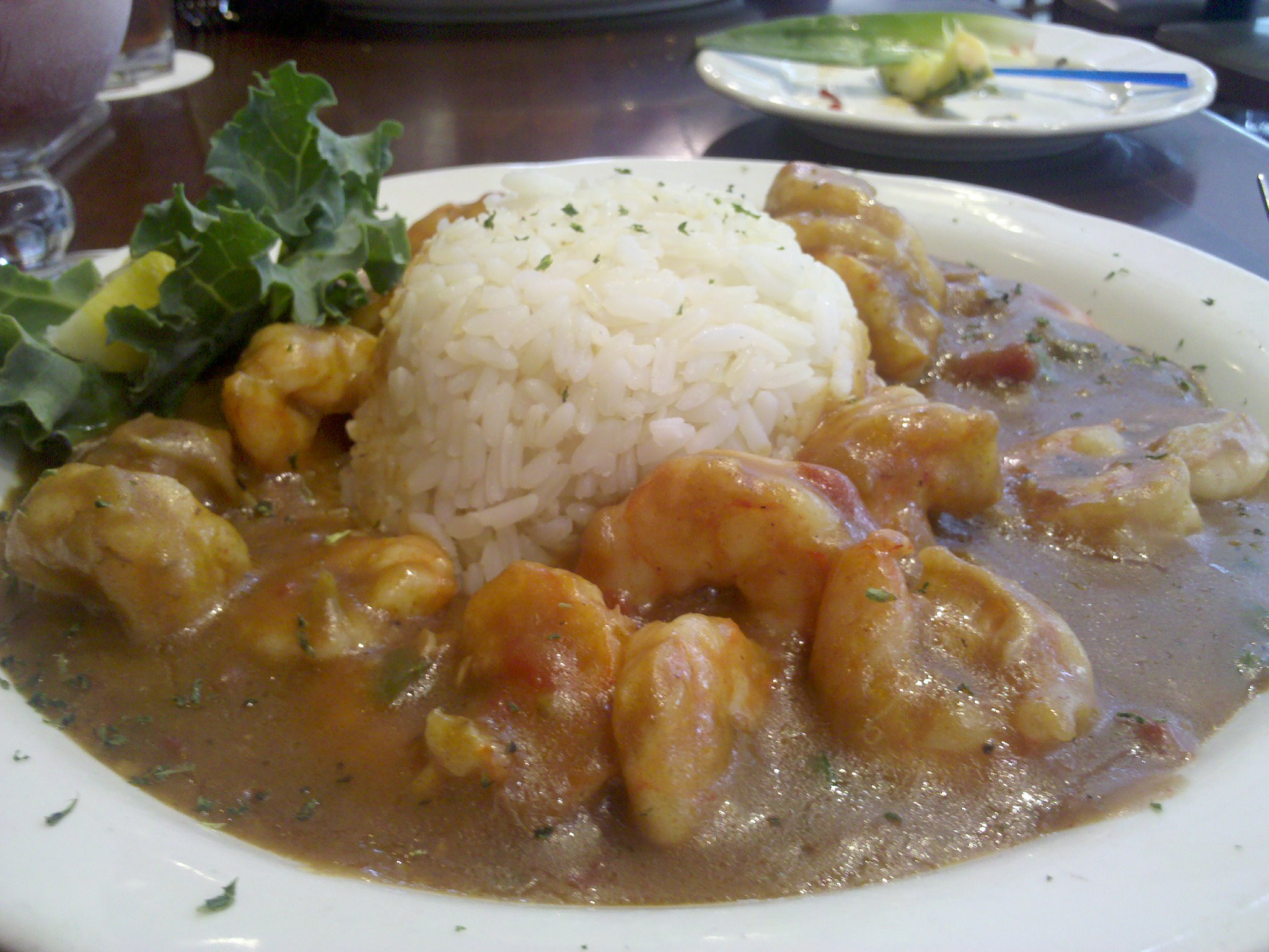 a plate topped with rice and some type of food