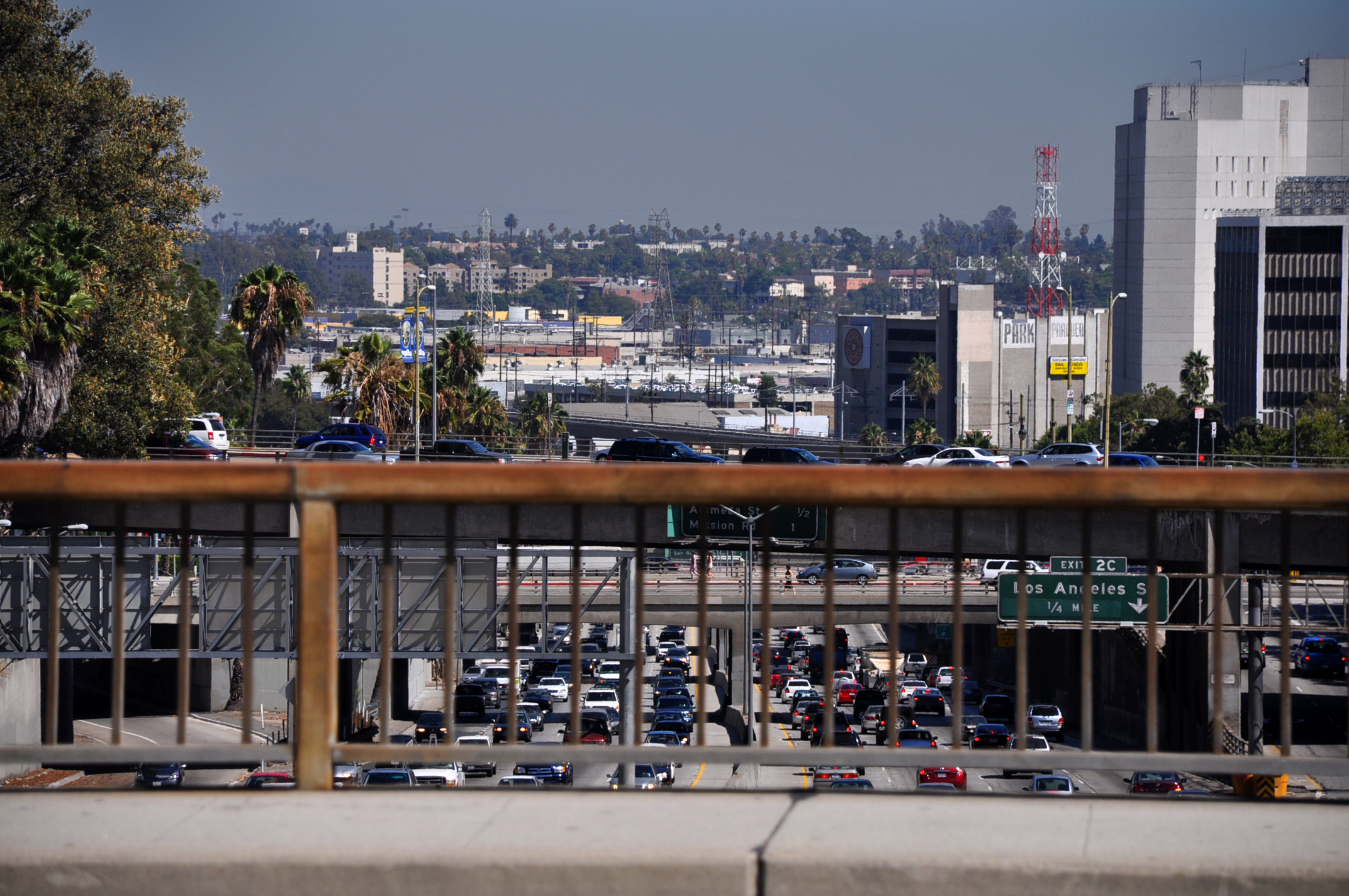 a view of a freeway with parked cars on it