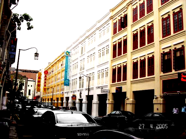 several cars parked in front of an office building