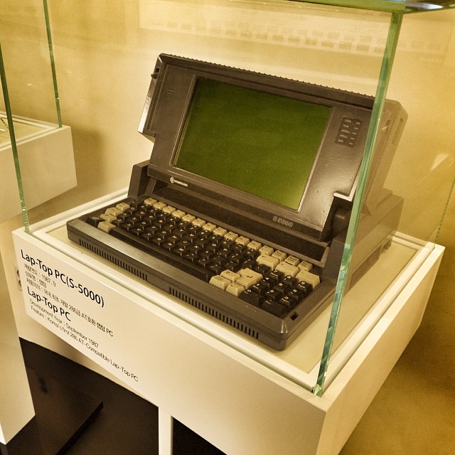 the old computer is on display in a glass case