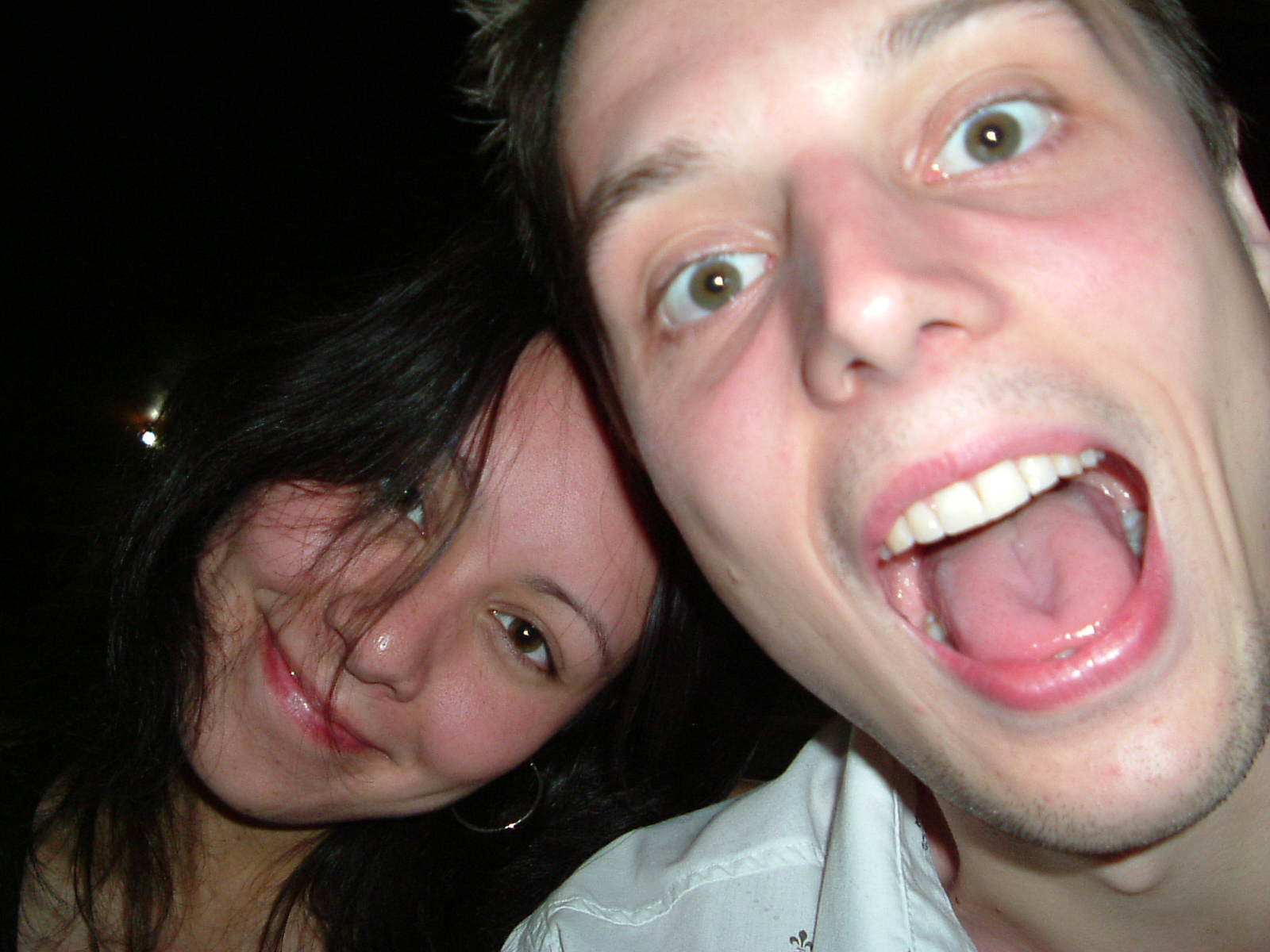 two people making a weird face at the camera