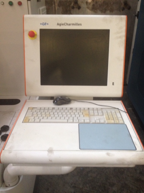 an old laptop computer with the keyboard missing