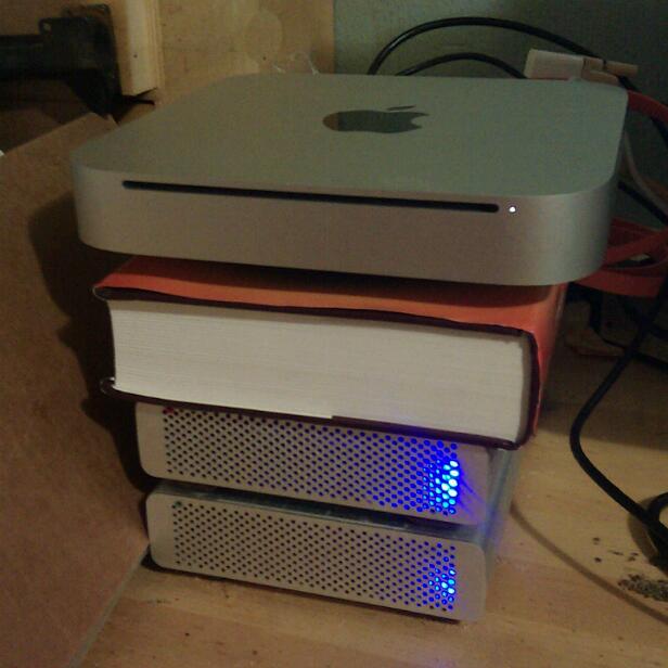 a stack of laptop computers that are sitting on a table