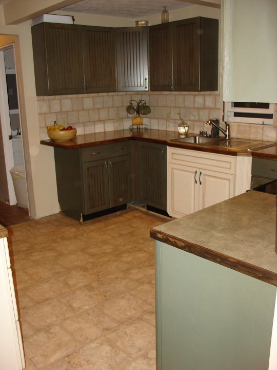 kitchen area of home with sink and refrigerator