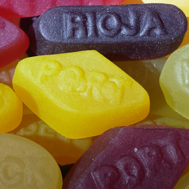an assortment of colorful candies with the word aon printed on them