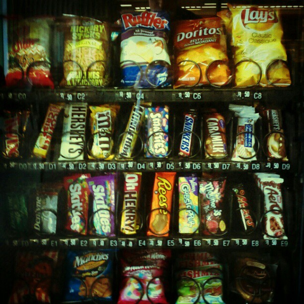 a vending machine filled with bags of snacks