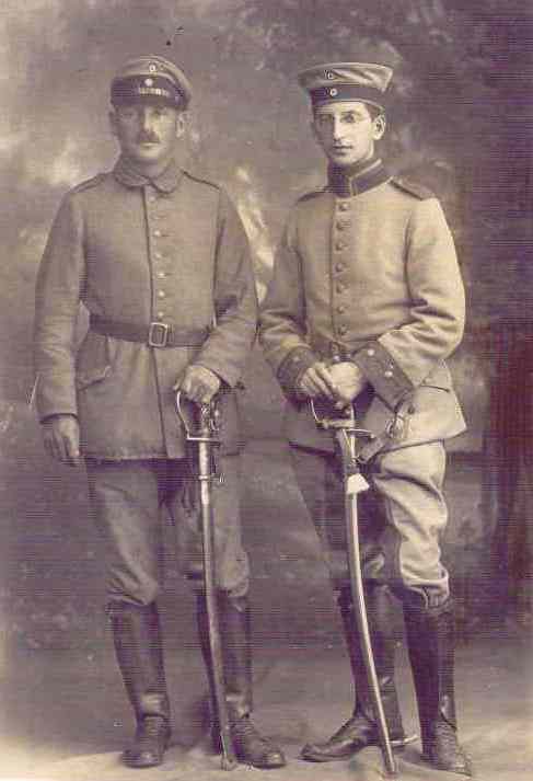 two soldiers standing next to each other with hats on